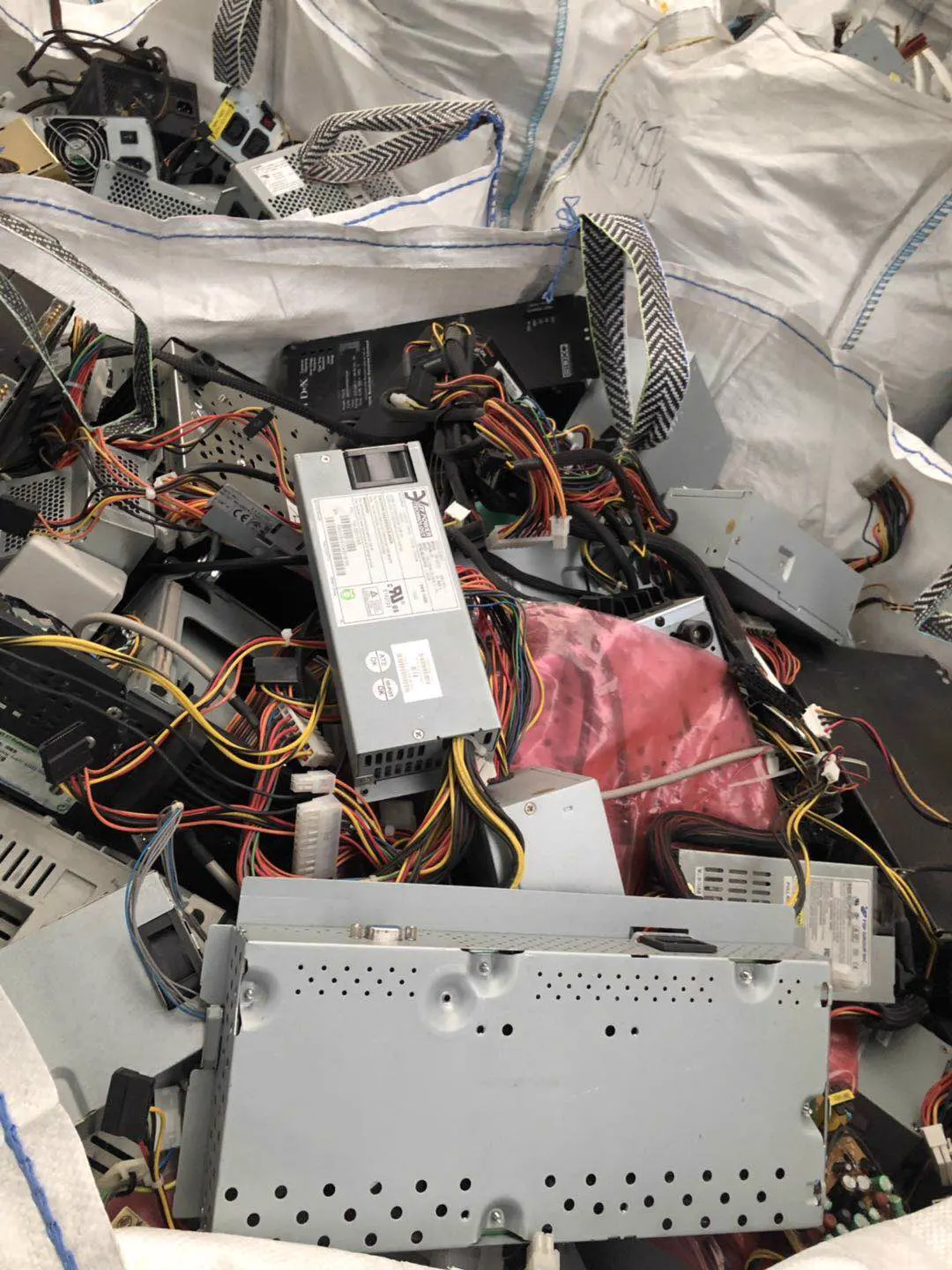 Desktop PSUs, cables still attached, ready for grading.
